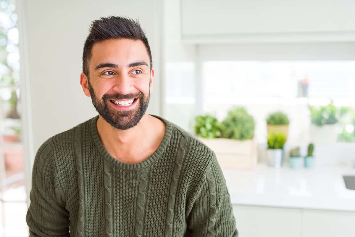 man smiling glad to have the benefits of sober living homes