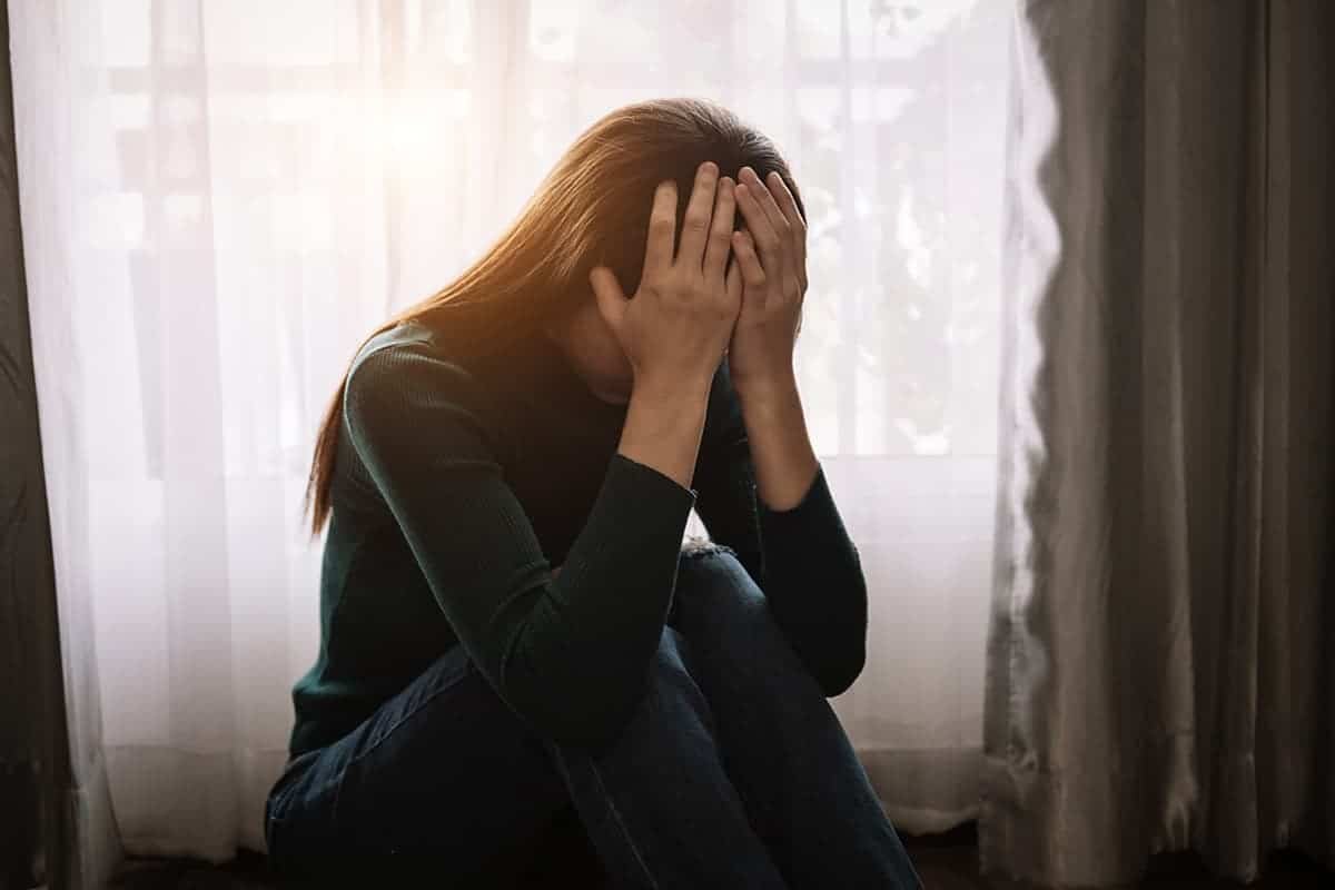 woman thinking about unresolved trauma and addiction